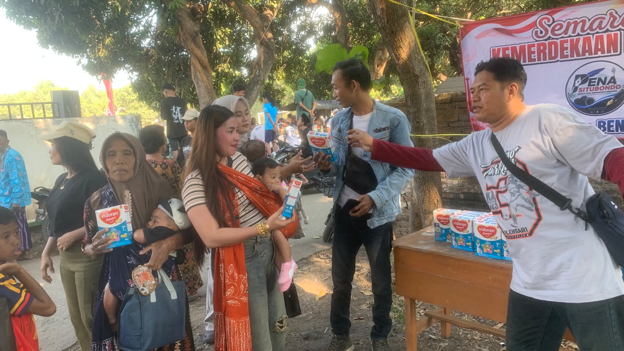 (*Wartawan (*PENA Situbondo*) Dan *Tim Sigap* Sejahtera Bagikan Susu Gratis Di Final Kades Cup 3 Kilensari*) 1 IMG 20260809 WA0082